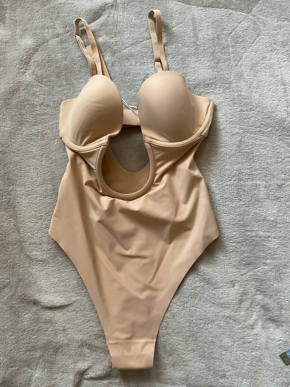 SKIMS Nude sleek scoop thong bodysuit.